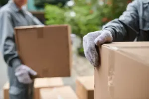 Team carrying removals boxes